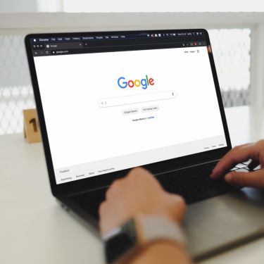 The image shows a open PC with google